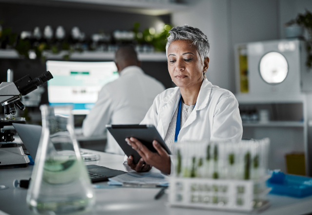 Laboratory professional reviewing information on a tablet